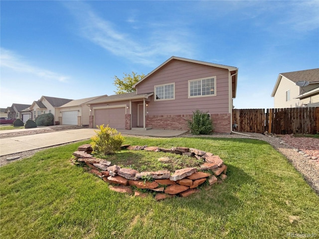 4011 W 28th Street Rd, Greeley, CO 80634 - view of front of property featuring driveway, a garage, and brick siding
