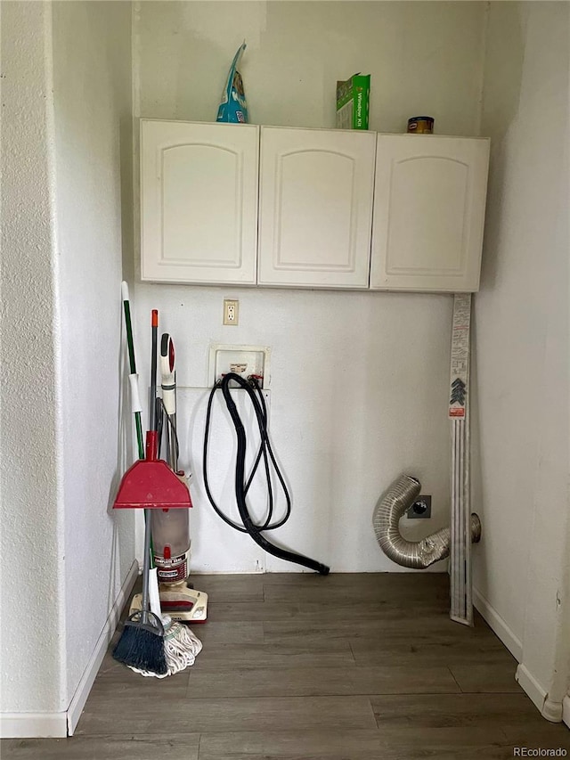 47904 Dartmouth Ave, Bennett, CO 80102 - laundry area featuring hookup for a washing machine, wood finished floors, cabinet space, and baseboards