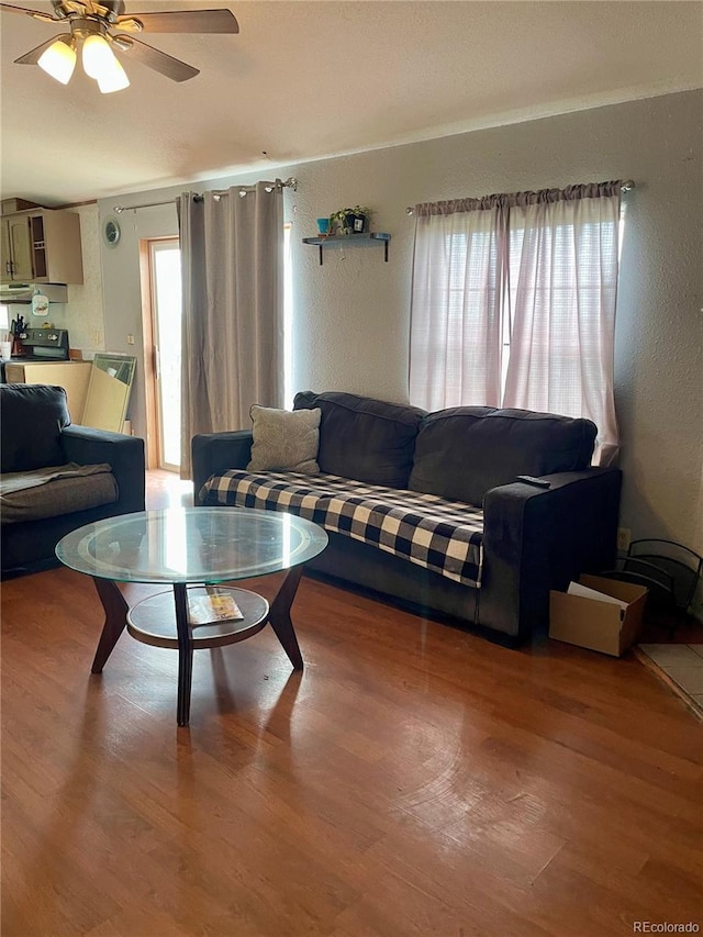 47904 Dartmouth Ave, Bennett, CO 80102 - living area with a textured wall, wood finished floors, and ceiling fan