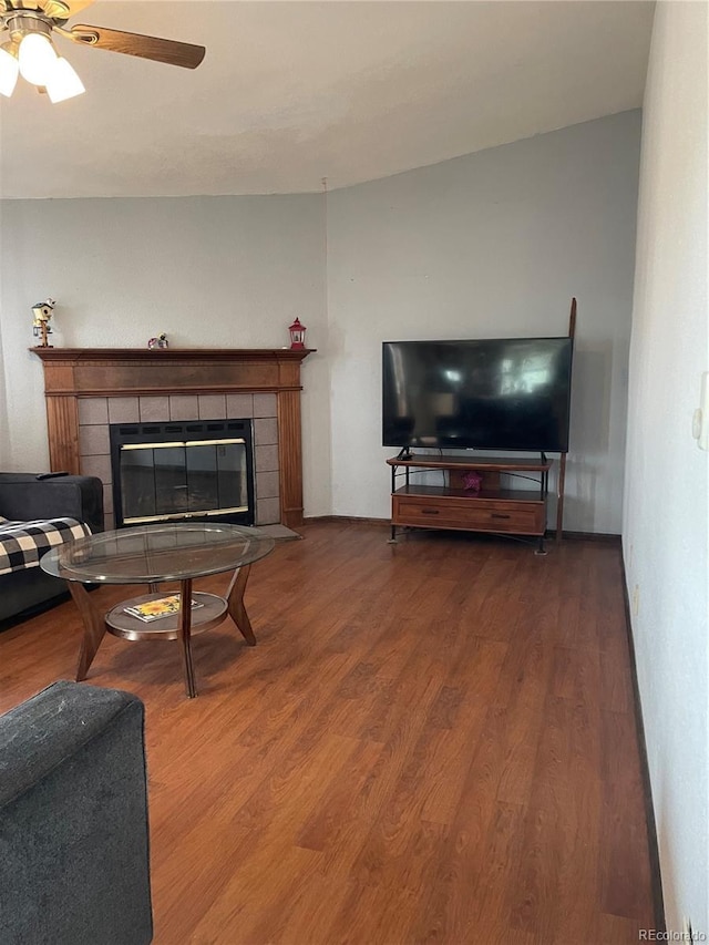 47904 Dartmouth Ave, Bennett, CO 80102 - living room with a fireplace, wood finished floors, and ceiling fan