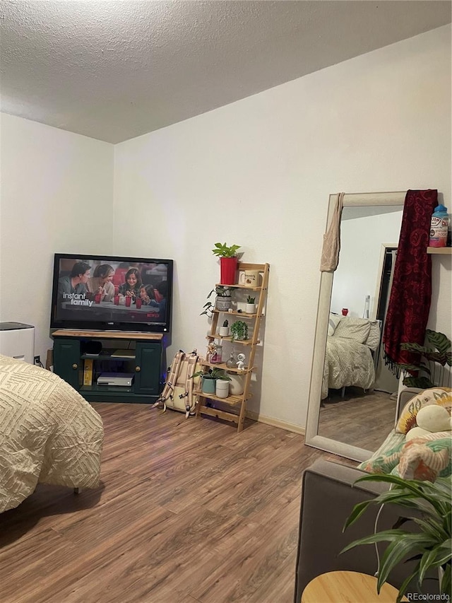 47904 Dartmouth Ave, Bennett, CO 80102 - bedroom featuring wood finished floors