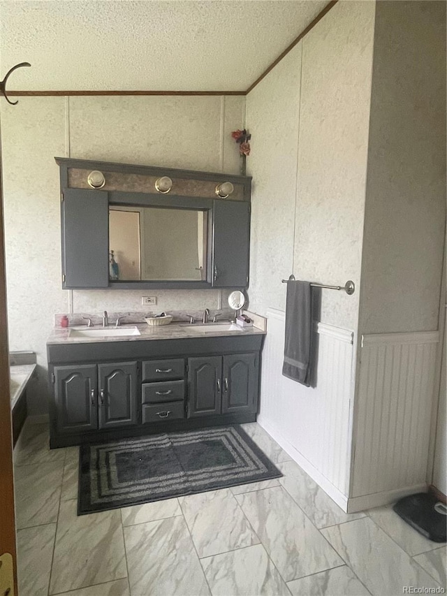 47904 Dartmouth Ave, Bennett, CO 80102 - full bath featuring a decorative wall, marble look tile flooring, double vanity, and wainscoting