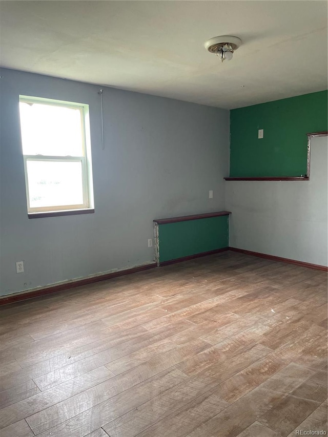 47904 Dartmouth Ave, Bennett, CO 80102 - empty room with wood finished floors and baseboards