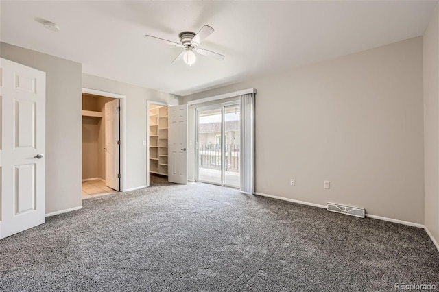 6727 S Race St, Centennial, CO 80122 - unfurnished bedroom with carpet, access to exterior, a spacious closet, and a ceiling fan