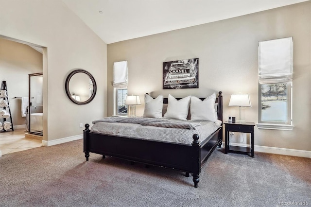 carpeted bedroom featuring vaulted ceiling and baseboards