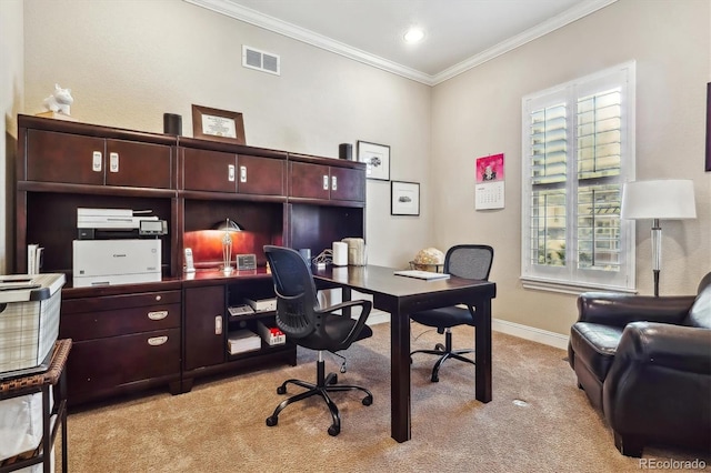 home office with ornamental molding, light carpet, visible vents, and baseboards