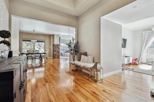 interior space with light wood-style flooring and baseboards