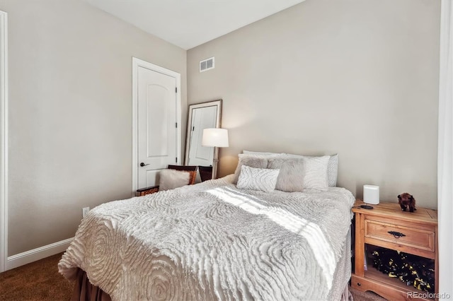 bedroom featuring carpet flooring, visible vents, and baseboards