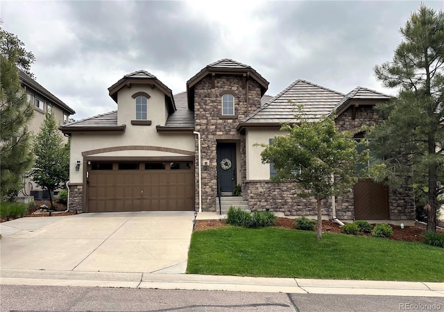 6875 Northstar Ct, Castle Rock, CO 80108 - view of front facade with stone siding, stucco siding, a front lawn, and concrete driveway