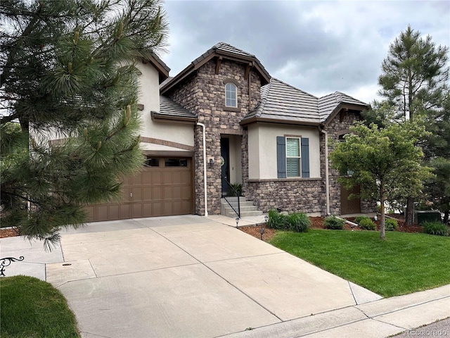 6875 Northstar Ct, Castle Rock, CO 80108 - view of front of property featuring stucco siding, a tiled roof, stone siding, concrete driveway, and a front lawn