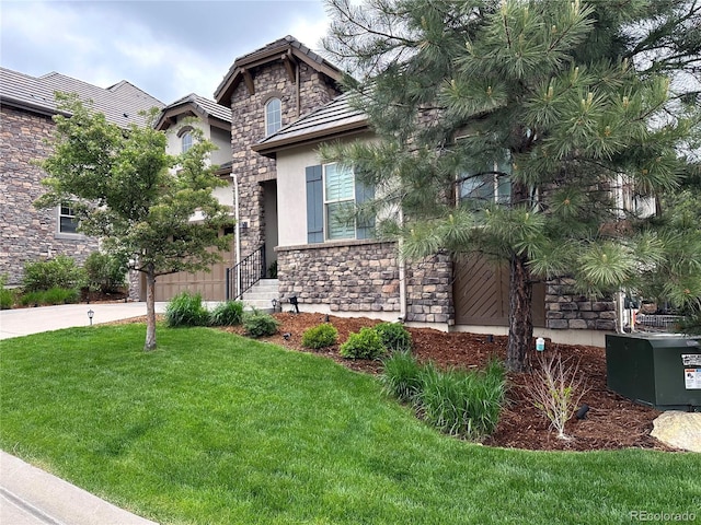 6875 Northstar Ct, Castle Rock, CO 80108 - view of front of house featuring stone siding, stucco siding, and a front lawn