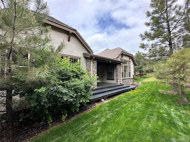 6875 Northstar Ct, Castle Rock, CO 80108 - view of green lawn featuring a deck