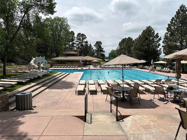 6875 Northstar Ct, Castle Rock, CO 80108 - community pool featuring a patio area, a water slide, and a gazebo