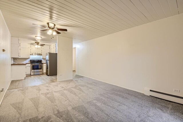 unfurnished living room with light carpet, a baseboard heating unit, ceiling fan, and wooden ceiling