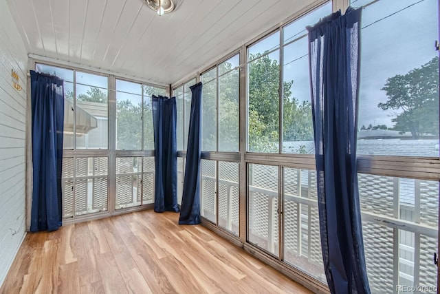 unfurnished sunroom featuring wood ceiling