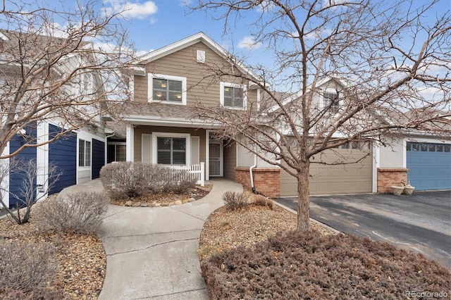 view of property with a garage and covered porch