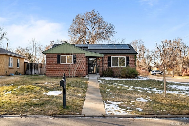 view of front of home with solar panels