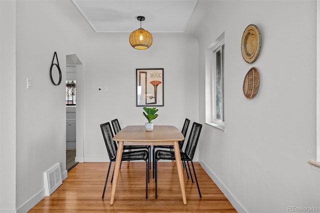 dining space with a healthy amount of sunlight and light wood-type flooring