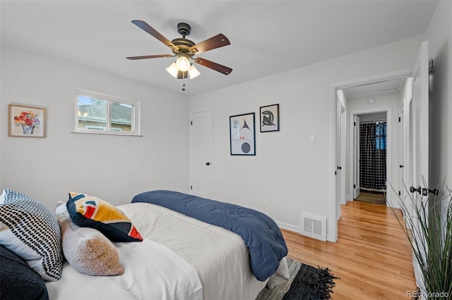 bedroom featuring ceiling fan and wood-type flooring