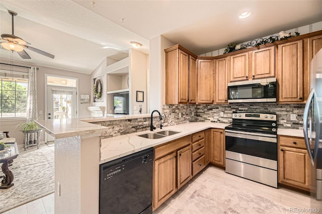 10467 W Hampden Ave Unit 204, Lakewood, CO 80227 - kitchen featuring appliances with stainless steel finishes, decorative backsplash, vaulted ceiling, light stone countertops, and ceiling fan