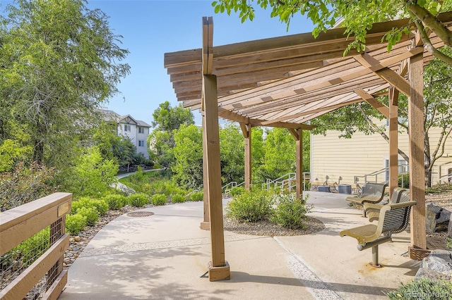 10467 W Hampden Ave Unit 204, Lakewood, CO 80227 - view of property's community featuring a pergola and a patio