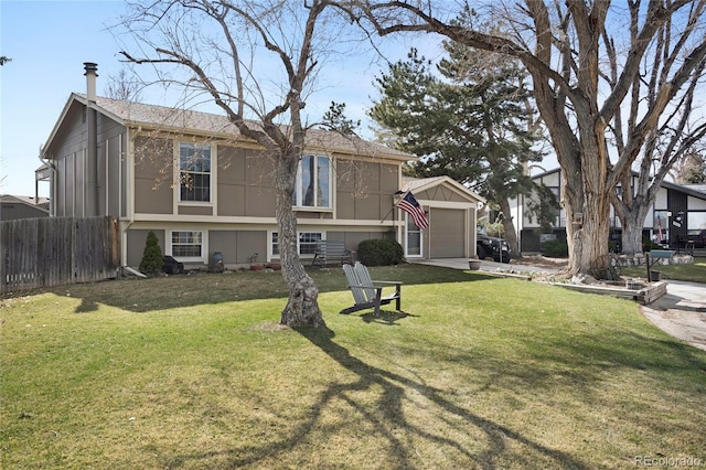 view of front facade with an outdoor structure, fence, and a front lawn
