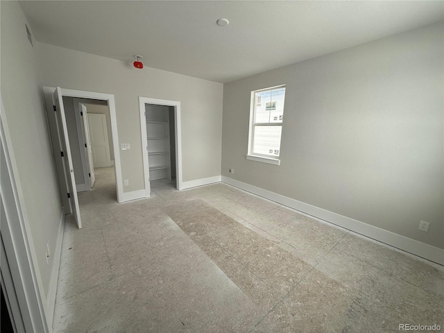 unfurnished bedroom featuring a closet