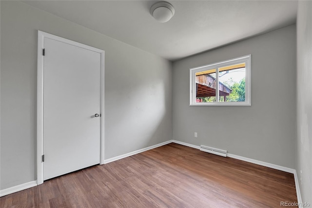 426 Kenton St, Aurora, CO 80010 - empty room featuring wood finished floors and baseboards