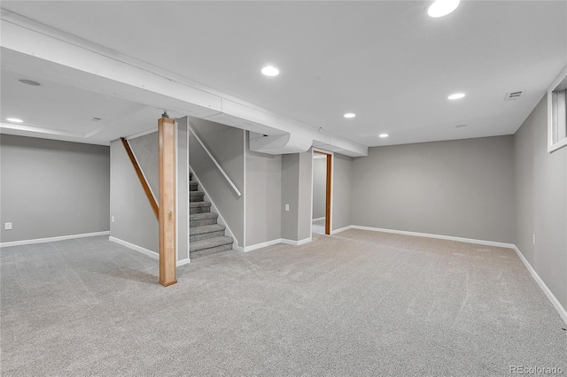 426 Kenton St, Aurora, CO 80010 - finished basement with light colored carpet, recessed lighting, and stairway