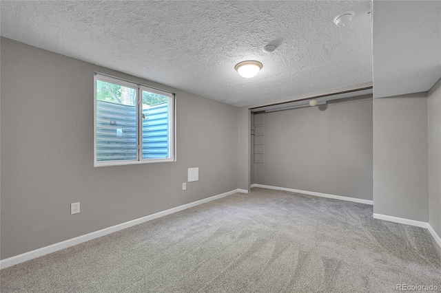 426 Kenton St, Aurora, CO 80010 - unfurnished bedroom with a textured ceiling and carpet floors