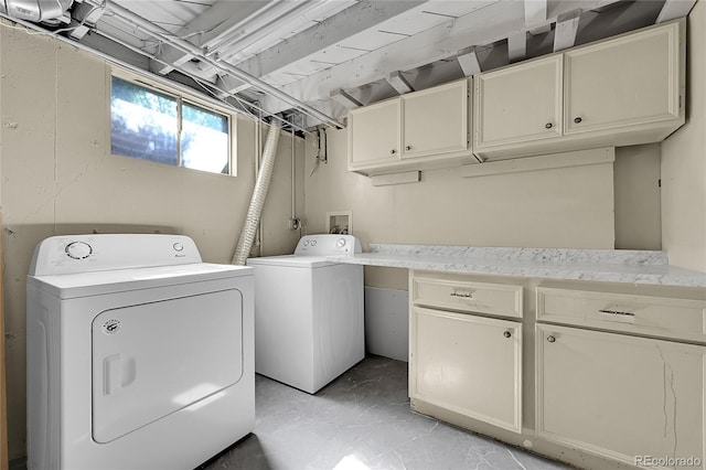 426 Kenton St, Aurora, CO 80010 - washroom featuring cabinet space and washer and dryer