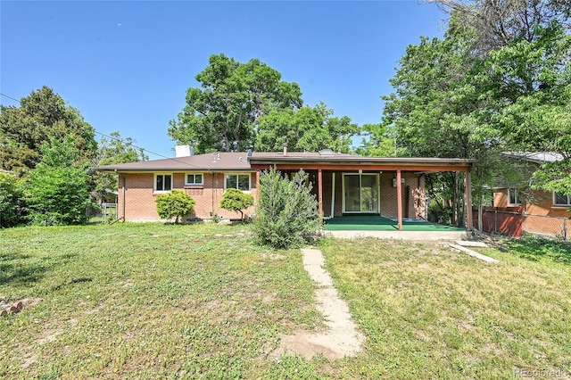 426 Kenton St, Aurora, CO 80010 - back of house with brick siding and a patio