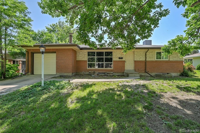 426 Kenton St, Aurora, CO 80010 - single story home featuring an attached garage, driveway, brick siding, and a front yard