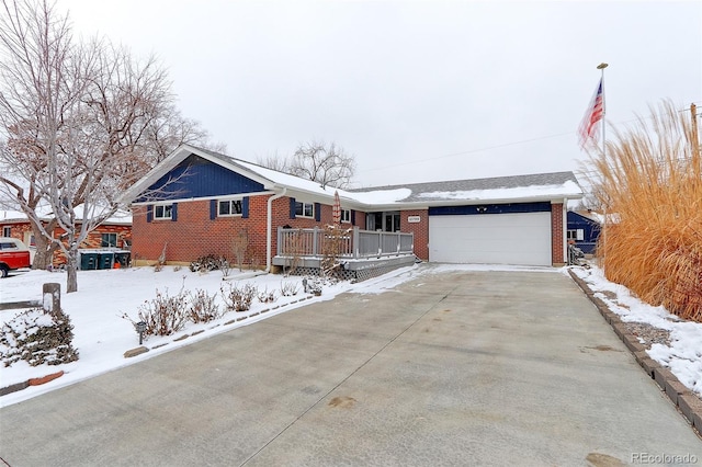 ranch-style house featuring brick siding, driveway, and an attached garage