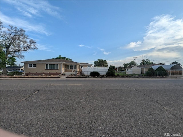 1009 Bush St, Brighton, CO 80601 - view of front of home with fence