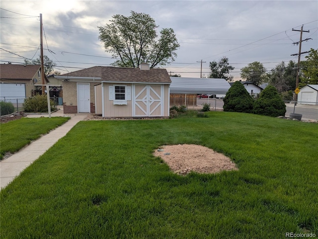 1009 Bush St, Brighton, CO 80601 - view of front of home featuring an outdoor structure, brick siding, a storage shed, and roof with shingles