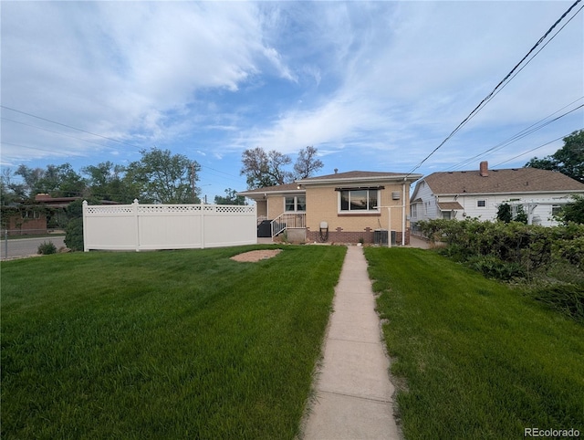 1009 Bush St, Brighton, CO 80601 - rear view of property with brick siding