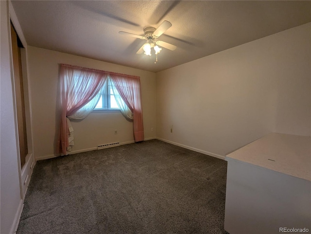 1009 Bush St, Brighton, CO 80601 - spare room with dark carpet, ceiling fan, baseboards, and a textured ceiling