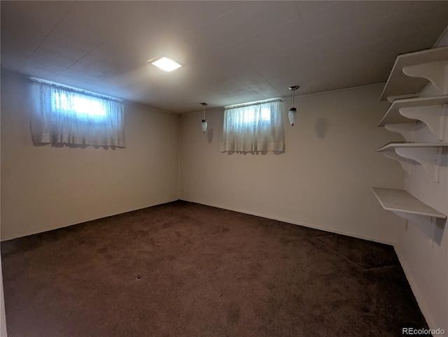 1009 Bush St, Brighton, CO 80601 - basement featuring dark colored carpet