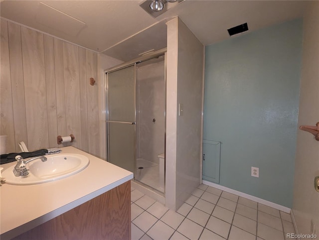 1009 Bush St, Brighton, CO 80601 - full bath featuring tile patterned flooring, a stall shower, vanity, and baseboards