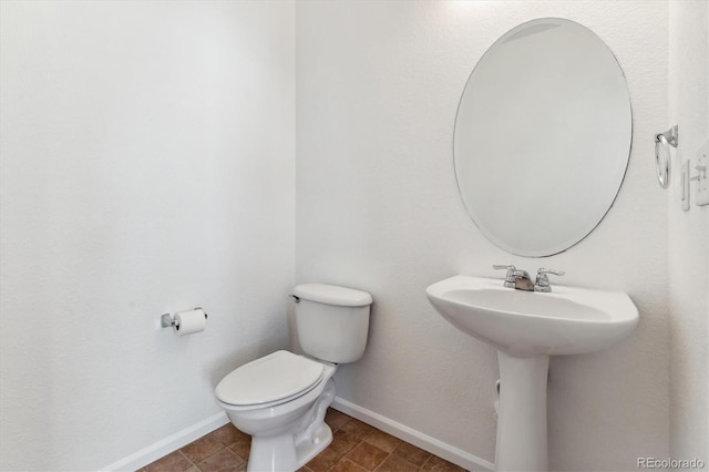 bathroom with toilet and sink