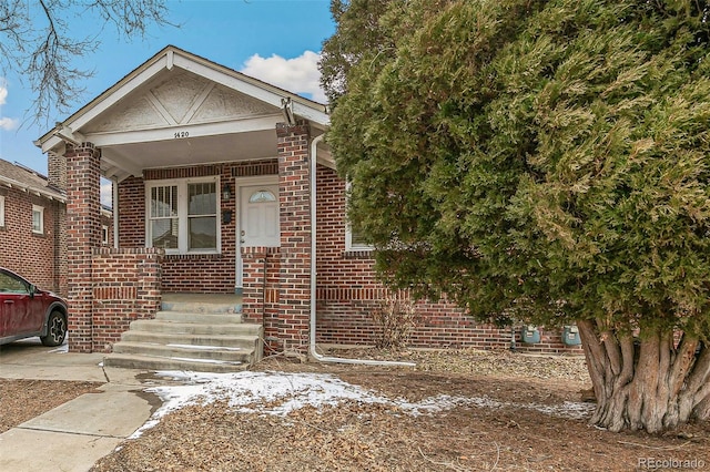 view of front of home with brick siding