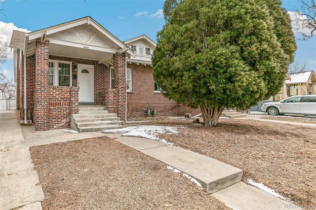 view of front of property featuring brick siding