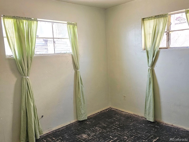 spare room featuring a wealth of natural light