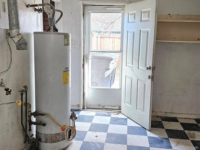 utility room featuring gas water heater