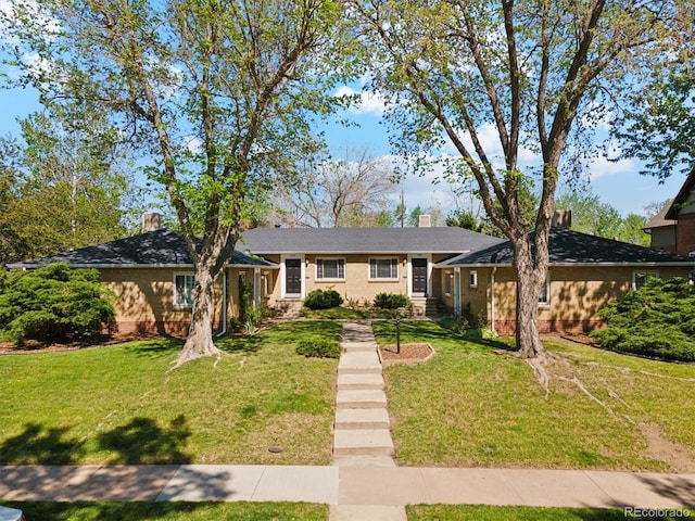236 S Clarkson St, Denver, CO 80209 - view of front of property featuring a front yard and a chimney