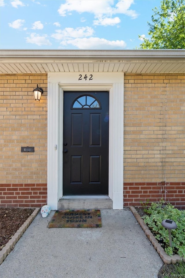 236 S Clarkson St, Denver, CO 80209 - doorway to property featuring brick siding