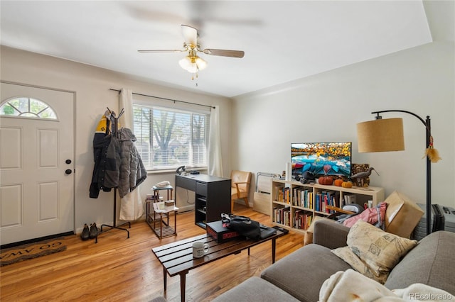 236 S Clarkson St, Denver, CO 80209 - living area featuring healthy amount of natural light, ceiling fan, and light wood-style flooring
