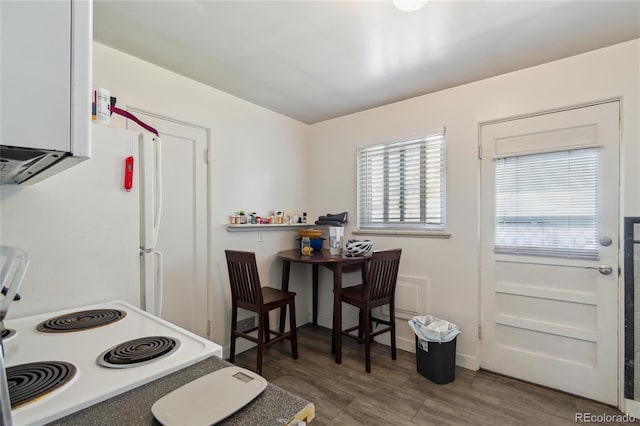 236 S Clarkson St, Denver, CO 80209 - kitchen featuring white appliances and wood finished floors