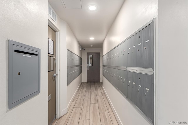 800 N Washington St Unit 804, Denver, CO 80203 - hall featuring mail area, light wood finished floors, baseboards, and recessed lighting